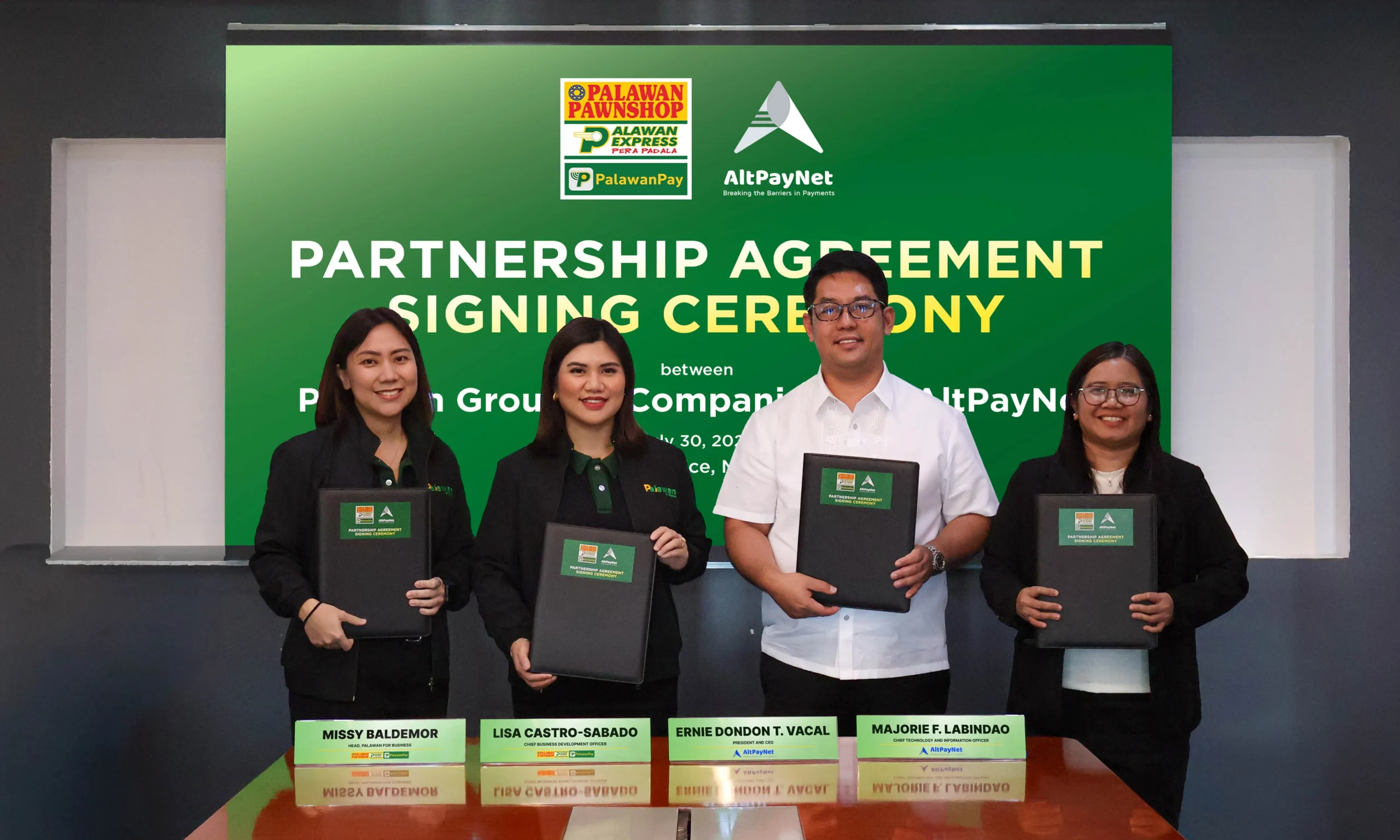 Representatives of the Palawan Group of Companies and AltPayNet presenting the signed agreement that expands access to international remittance services