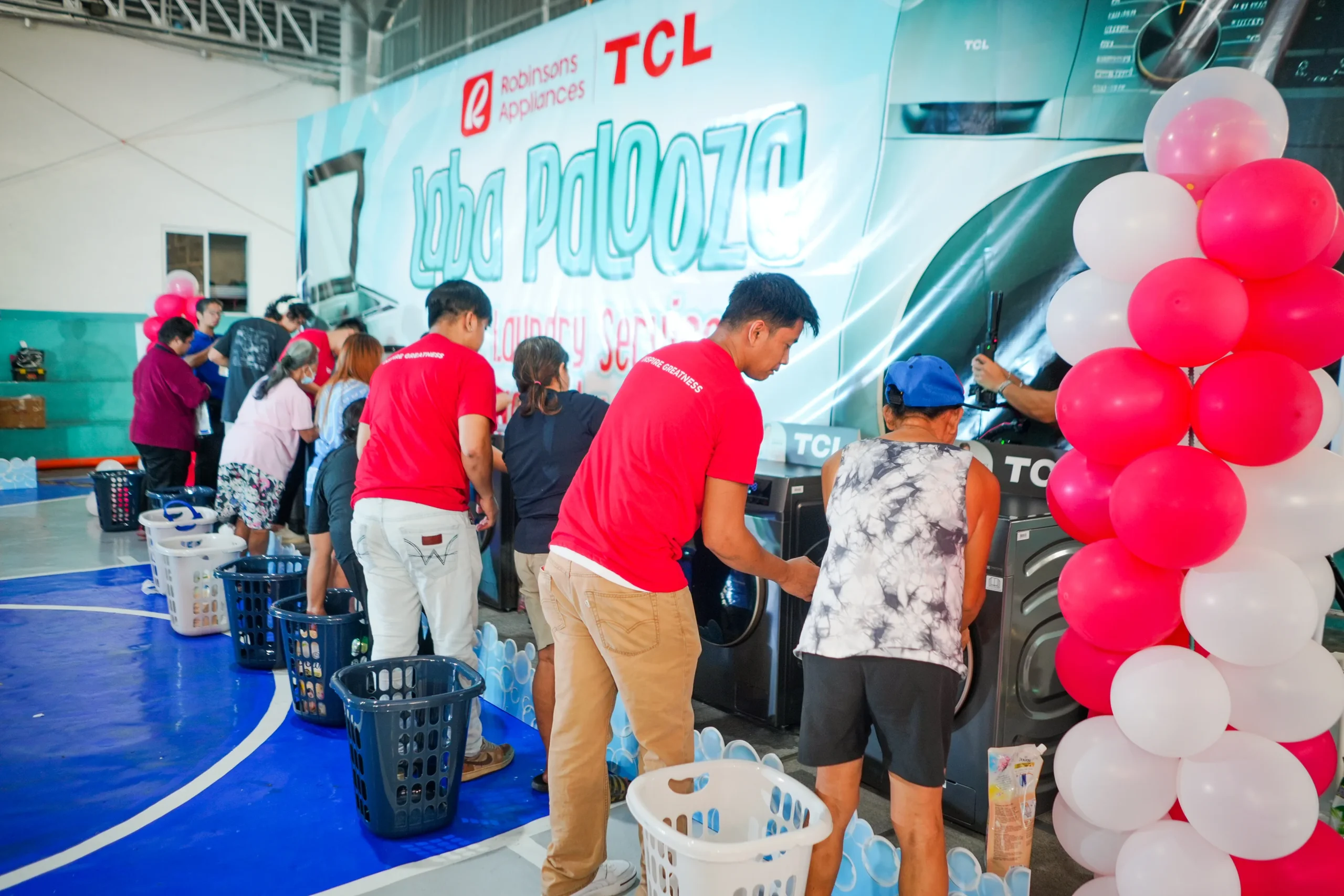 Families take part in activities and booths at the TCL Labapalooza community event