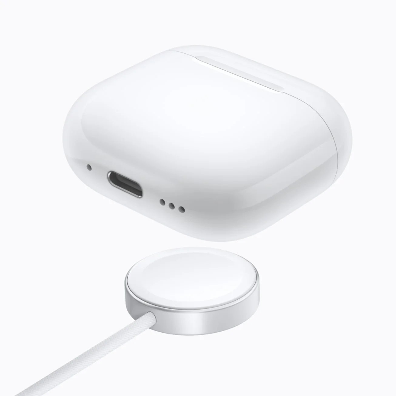 AirPods 5 with Wireless Charging Case on a charger