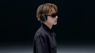 V of BTS wearing the Nothing Headphone (1) Pro in black for Nothing's new campaign