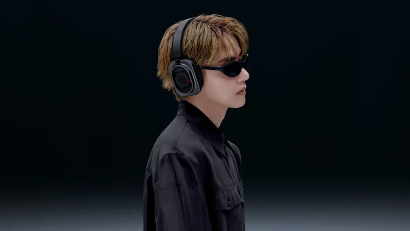 V of BTS wearing the Nothing Headphone (1) Pro in black for Nothing's new campaign