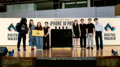 Digital Walker iPhone 18 Pro midnight launch: the first customers in line hold the 001 queue sign at Glorietta
