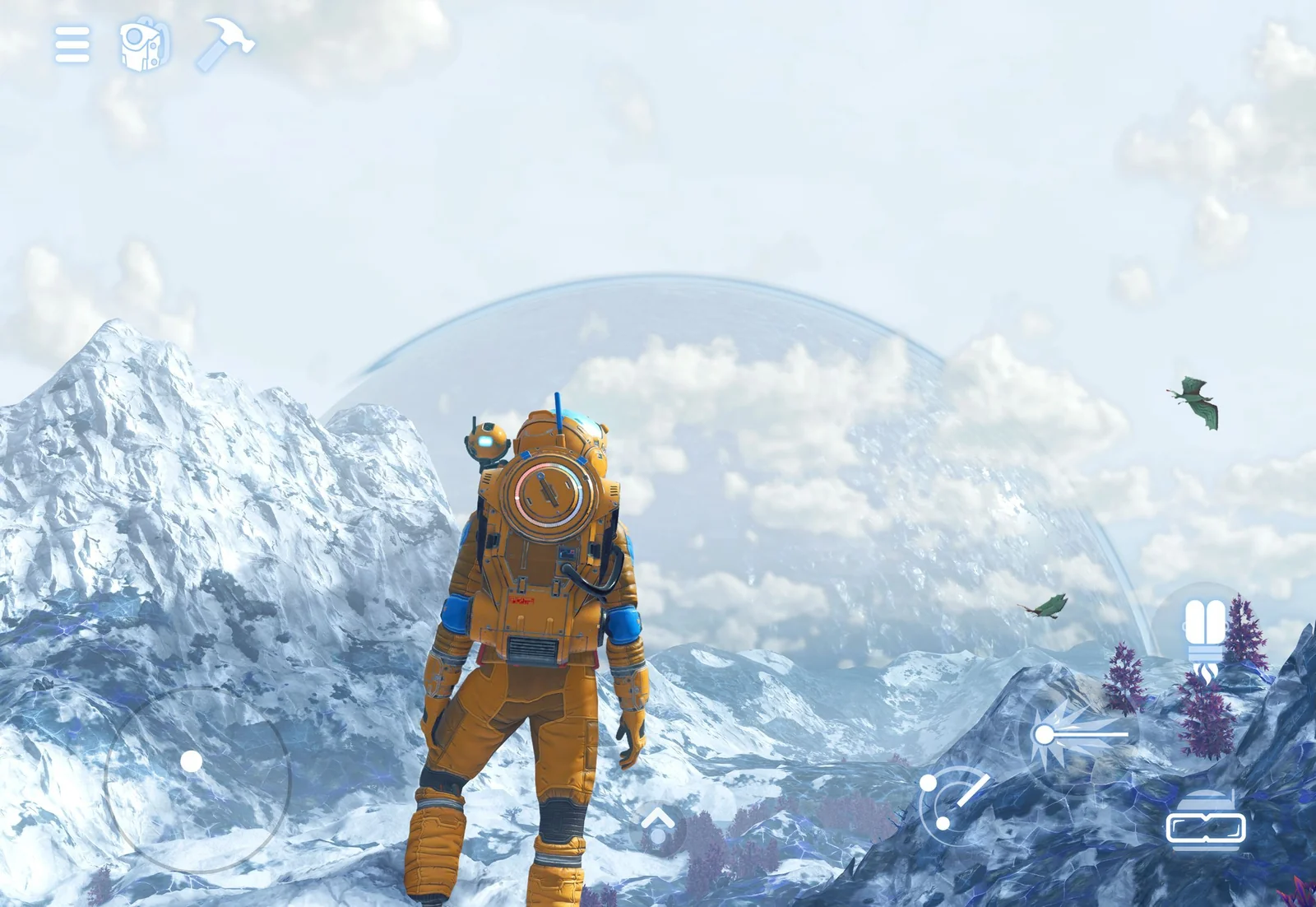 A No Man's Sky explorer on a snowy mountain ridge beneath a ringed gas giant on iPad